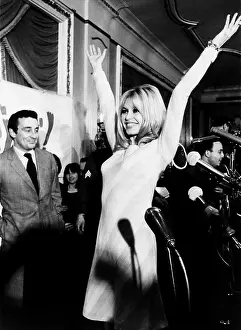 Brigitte Prints: Brigitte Bardot shows her form for newsmen at her press conference at the Plaza Hotel