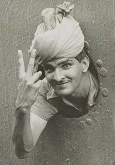 Porthole Prints: British Indian soldier he gives the V sign from a port-hole of a ship on arrival in Singapore
