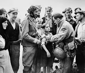 Parachutes Prints: British liberator of Greece, pinning a British band on the arm of a young boy