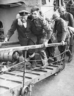 Helping Prints: A British sailor assisting a wounded Tommy followed by French Troops