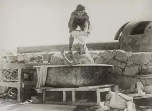 Lcgr1310 Prints: British soldier gives thumbs up for a bath near a coastal gun in the Western Desert