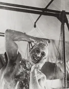 Lcgr1310 Prints: British soldier in the Western showers in a mobile bath unit