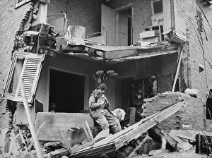 War 2 Prints: British Trooper rescued a puppy from the ruins German apartment in Geilenkirchen