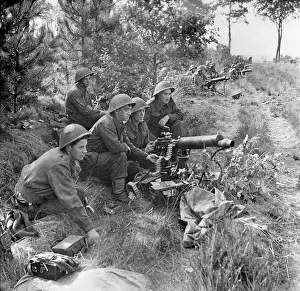 Allied Prints: British troops at action stations ready to provide covering fire for the infantry crossing a canal