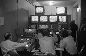 Producers Prints: Broadcasting technicians, seated in front of bank of television sets at the Democratic Headquarters