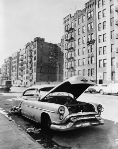 Street Scenes Prints: Bronx street in New York City. An abandoned automobile