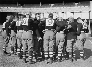 Informal Prints: Brown University football team in a huddle at the Polo Grounds