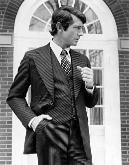 Trends Prints: Brown wool and silk three-piece suit is pin striped with gold and white