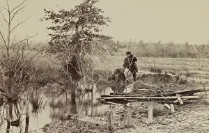 Bull Run River in March 1862, 8 months after the First Battle of Bull Run (First Manassas). In the right foreground are wooden markers of soldiers graves