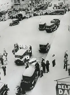 Automobiles Prints: Bullet-riddled taxi and two dead gangsters in a NYC street after a gun battle with police