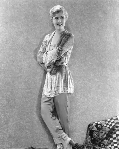 Negligee Prints: BUTTERFLIES IN THE RAIN, Laura Le Plante in negligee of crepe trousers and metalic brocade blouse