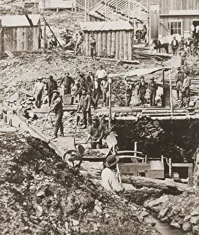 Tools Prints: Bystanders watch as crew drifting mining for gold below Discovery Point