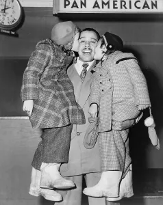 Big Band Prints: Cab Calloway (1907-1994), greeted by his daughters, Chris and Lael, at the airport in 1951