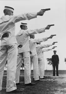 Target Practice Prints: Five cadets at the U.S. Naval Academy, Annapolis, shooting pistols. July 1942