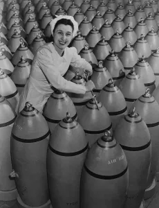 Bombs Prints: Canadian woman munitions worker tightening the nose plugs on 500-pound aerial bombs