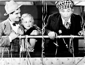 Tweed Cap Prints: THE CAPTAIN HATES THE SEA, from left, John Gilbert, Wynne Gibson, Victor McLaglen, 1934
