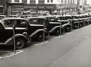 Lined Up Prints: Cars parked diagonally along parking meters