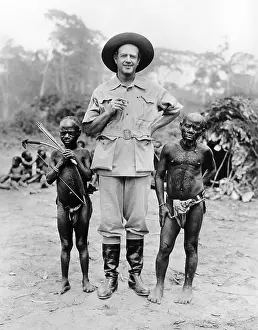 Contrast Prints: Caucasian man with two African pigmy men