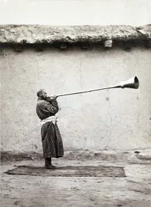 Ethnic Prints: Central Asian man playing a long necked Uzbek instrument called a karnay. 1868