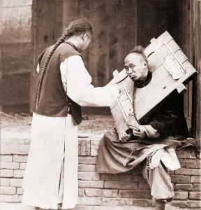 Pigtails Prints: Charitable Chinese man feeding a criminal in a cangue