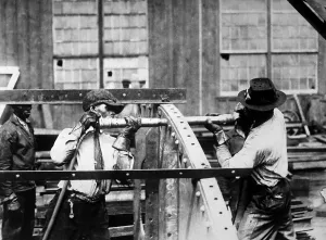 Speed Prints: Charles Knight (left) who won the prize offered by the London Mail for expert rivet driving