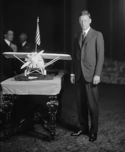 Aeronautics Prints: Charles Lindbergh 1902-1974 photographed beside a model of THE SPIRIT OF ST