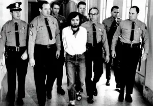 Evil Prints: Charles Manson, 1971, being led away in handcuffs after being found guilty of murder