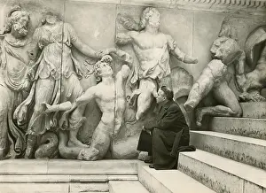 Movie Stars Prints: Charlie Chaplin on the steps of the Greek Alter at the Pergamon Museum in Berlin