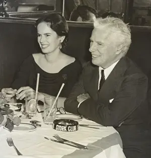 Restaurant Prints: Charlie Chaplin and wife Oona O'Neill dining at the Stork Club