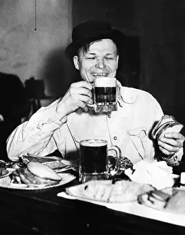 Drinkers Prints: Chicago worker enjoys a saloon lunch that provided free food to go with the purchased beer