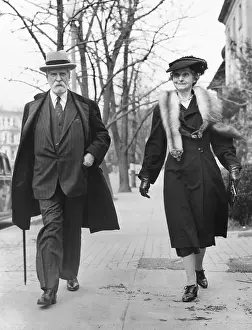 Of State Prints: Former Chief Justice Charles Evans Hughes and Antoinette Carter Hughes walk in Washington