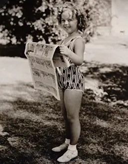 Ankle Socks Prints: Child actress, Shirley Temple, reads the funny papers at the Desert Inn