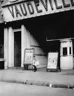 Vaudeville Prints: Child labor in front of a movie theater