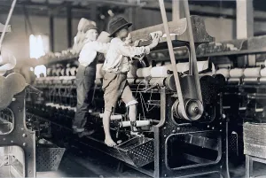 Child laborer portrayed by Lewis Hine in 1909
