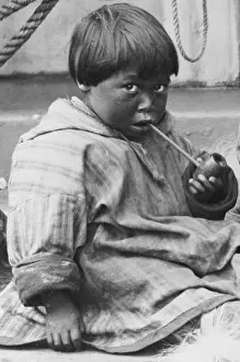 Images Dated 9th July 2008: Child learning to smoke a pipe