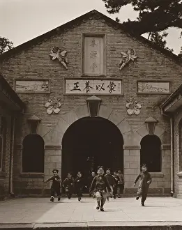 Prosperous Prints: Children running out the entrance of a school building in China