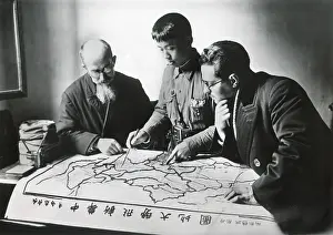 Christians Prints: Chinese army officer and two missionaries plot the advance of Communist forces