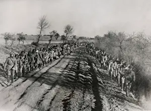 Kuomintang Prints: Chinese Civil War 1946-1949. Soldiers of the Chinese Nationalist Army march along a rutted road in Manchuria