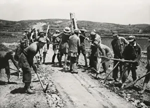 Construction Prints: Chinese Civil War 1946-1949. Volunteers from the Communist Chinese Army constructing a road