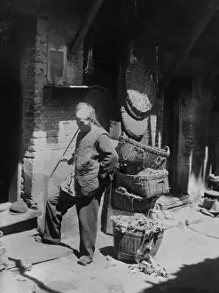 Dwelling Prints: Chinese man smoking long pipe in Rag Pickers Alley