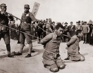 Executions Prints: Two Chinese men kneeling prior to execution by Chinese soldiers