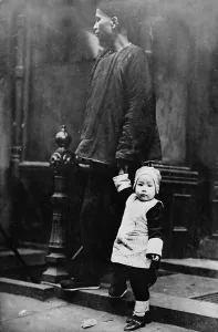Chinatown Prints: Chinese New Year, Chinese child with an adult on step outside of building