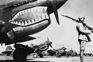 Lcgr1312 Prints: Chinese soldier guards a line of American P-40 fighter planes, ca. 1942