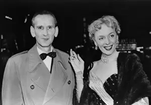 Christine Prints: Christine Jorgensen arrives at theater with her escort, Charles Yates on Dec. 22, 1953