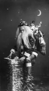 Santa Claus Prints: Christmas, caught in the act, Santa Claus on top of chimney, photograph, 1900