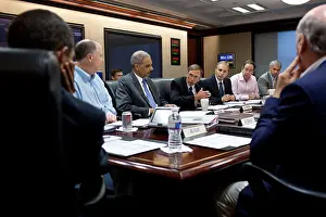 Intelligence Prints: CIA Director David Petraeus speaking during a National Security meeting as Obama (left) listens