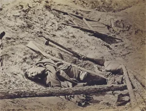 Confederacy Prints: The Civil War, dead Confederate soldier lying in a trench
