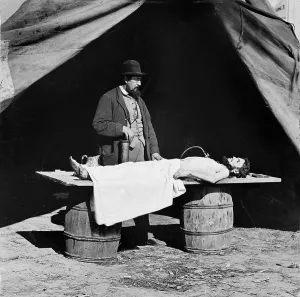 Surgeon Prints: The Civil War, embalming surgeon at work on soldier's body, photograph, 1860-1865