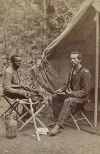 Protection Prints: Civil War Union officer of 23d New York Infantry smoking a long stem pipe outside his tent