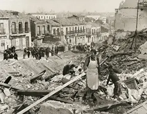 Homeless Prints: Civilians in Madrid search through the rubble of their homes in Liberated Madrid'